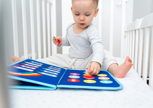 Kid playing Busy Book, Baby Funtasy, Quiet book